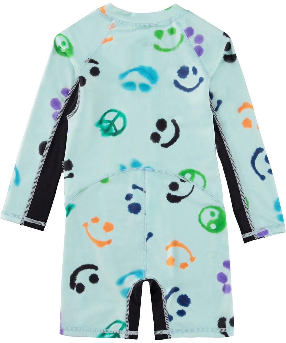 Neka LS - Multi Smile - Blå baby svømmedragt med lange ærmer og allover akvarel print