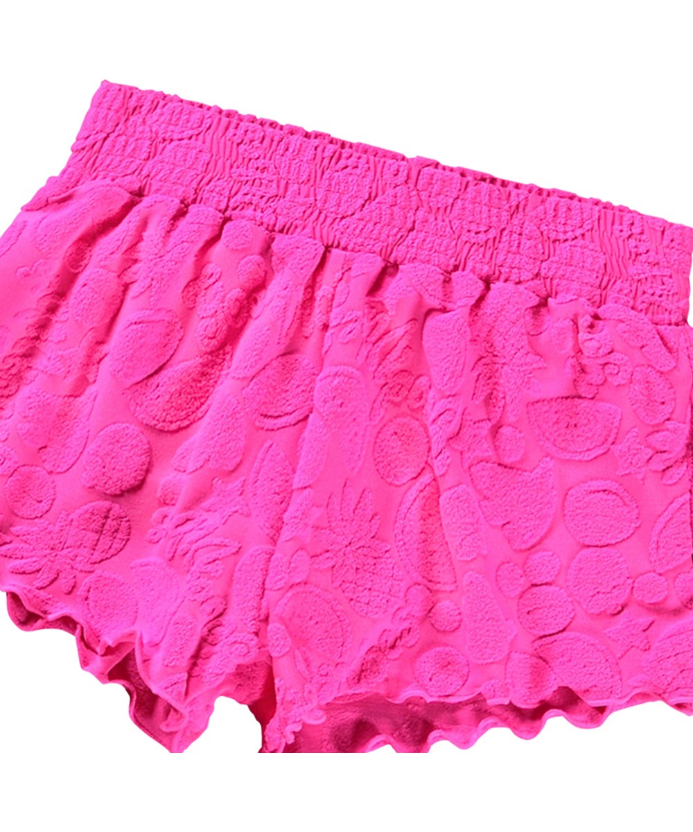 Nicci - Fruity Terry - Pink badeshorts til aktive børn med UV-beskyttelse 50+ og et mønster af eksotiske frugter.