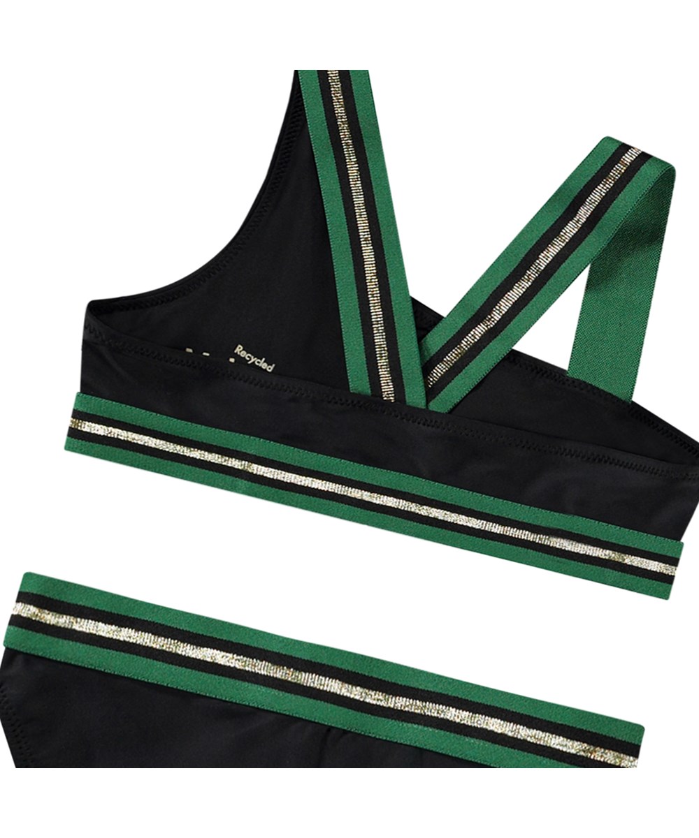 Nicola - Black - Asymmetrisk sporty bikini til aktive børn fremstillet i genanvendt polyester med UV-beskyttelse 50+