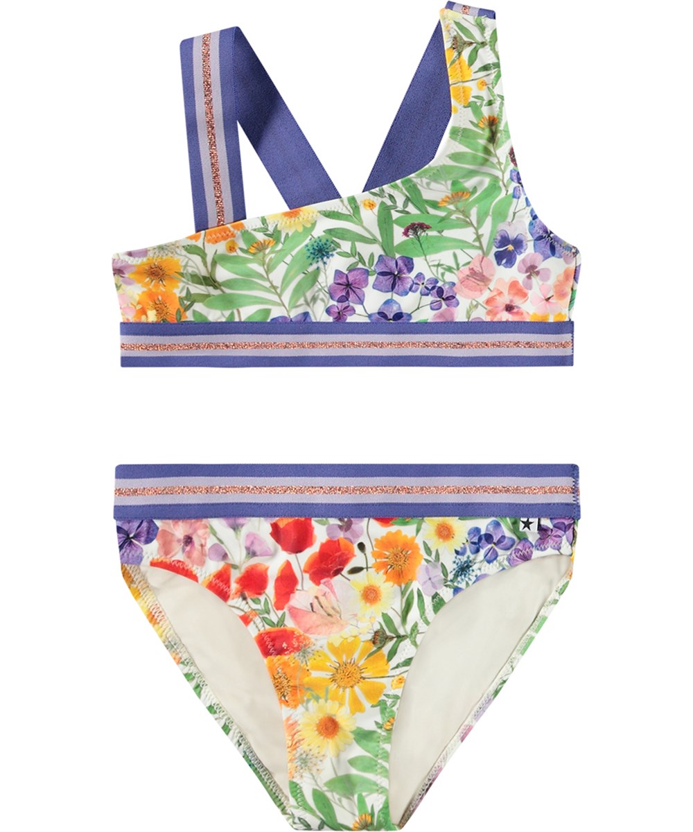 Nicola - Flowerpress - Asymmetrisk sporty bikini til aktive børn fremstillet i genanvendt polyester med UV-beskyttelse 50+