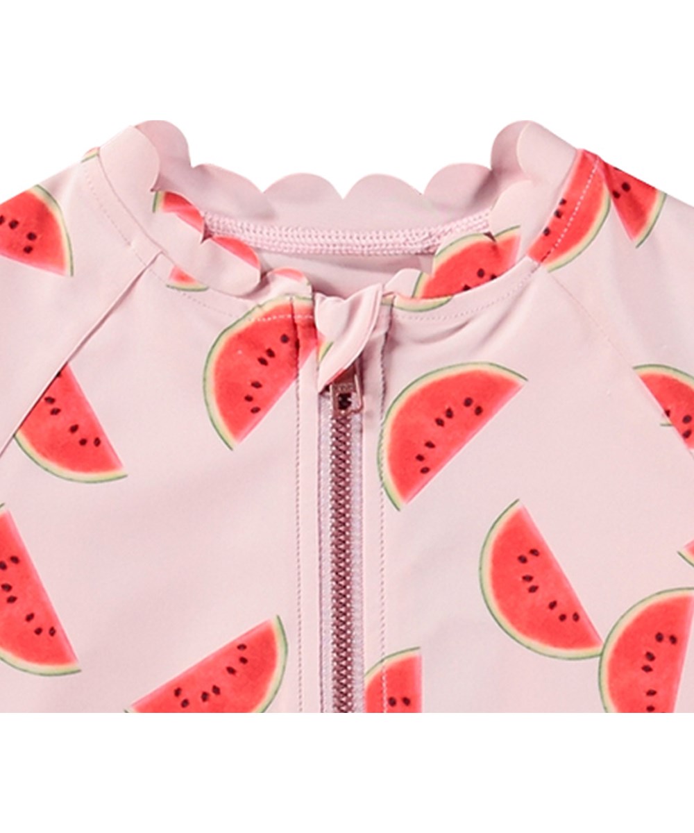 Nigella - Melon Pink - Lyserød badedragt til børn med korte ærmer og ben i genanvendt polyester og UV-beskyttelse 50+.