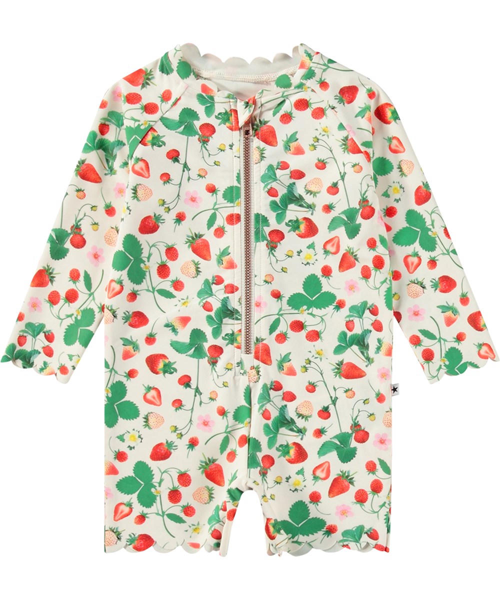 Nigella - Strawberry Field - Hvid badedragt til børn med lange ærmer og korte ben i genanvendt polyester og UV-beskyttelse 50+.