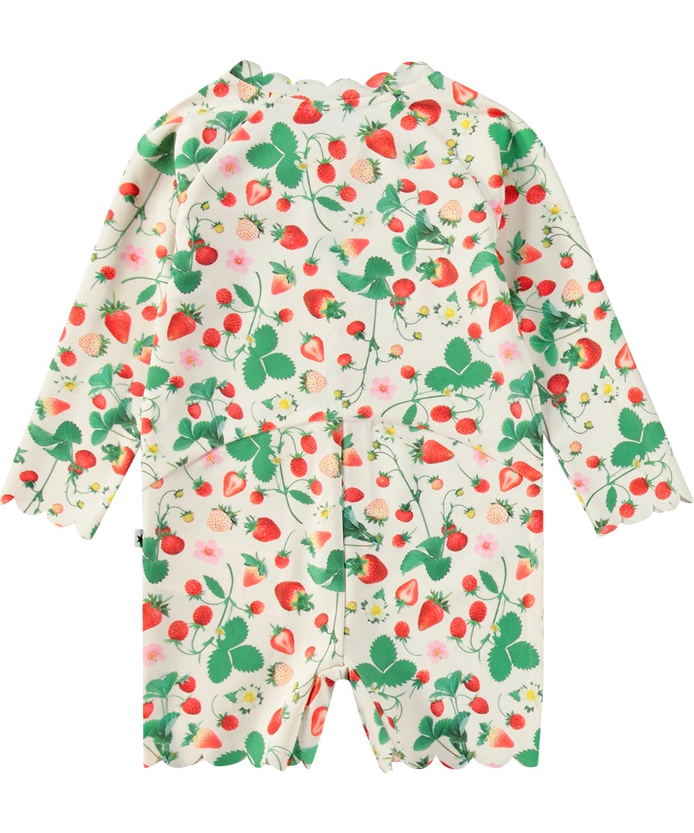 Nigella - Strawberry Field - Hvid badedragt til børn med lange ærmer og korte ben i genanvendt polyester og UV-beskyttelse 50+.