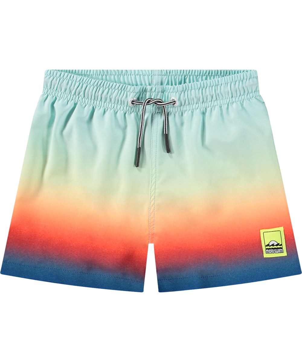 Niko - Blue Fade - Lyseblå sporty badeshorts til aktive børn i genanvendt polyester med UV-beskyttelse 50+.