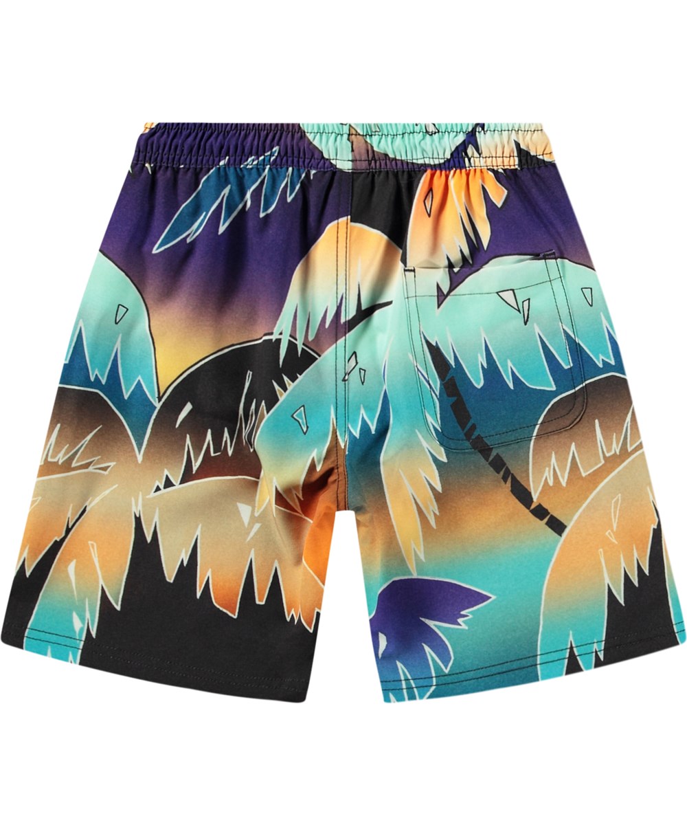 Nilson - Faded Palmtrees - Knælange badeshorts til aktive børn i genanvendt polyester med UV-beskyttelse 50+.