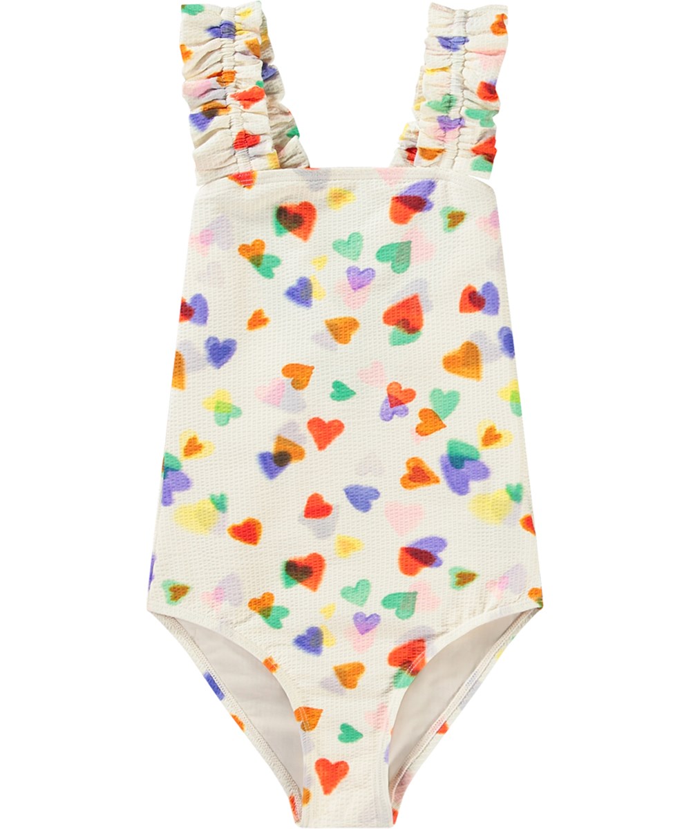 Nitika - Rainbow Hearts - Hvid badedragt til aktive børn i genanvendt polyester med UV-beskyttelse 50+.