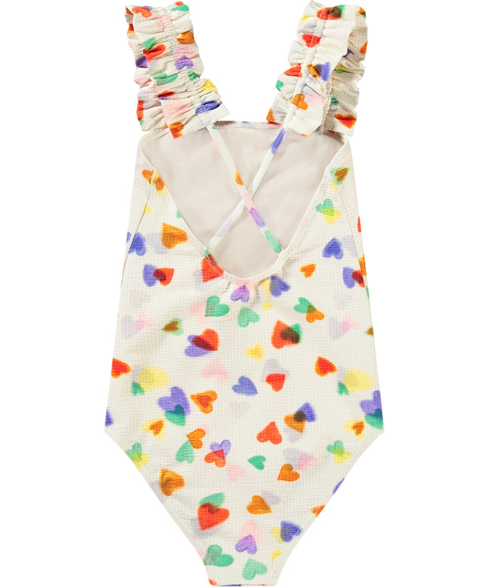 Nitika - Rainbow Hearts - Hvid badedragt til aktive børn i genanvendt polyester med UV-beskyttelse 50+.