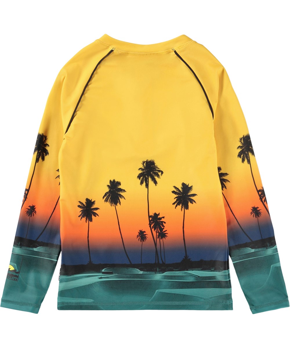 Noble - Sunset Skate - Gul badebluse med skateprint og lynlås til børn fremstillet i genanvendt polyester med UV-beskyttelse 50+.