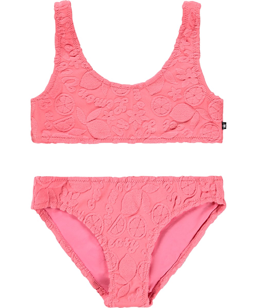 Nola Terry - Lemon Quotes - Pink, strækbar bikini til børn med citrusmønster i genanvendt polyester og UV-beskyttelse 50+.