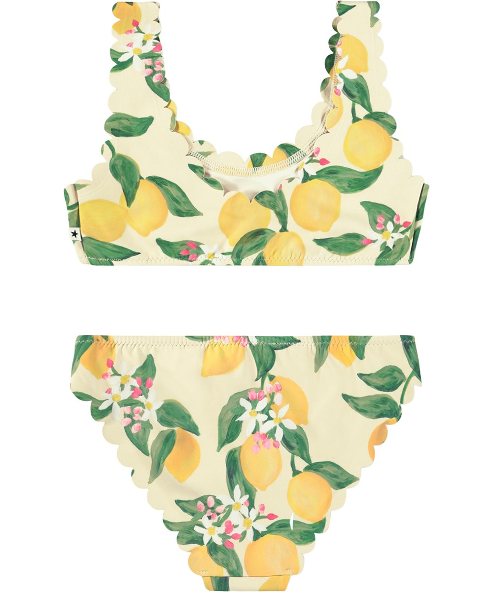 Nolina - Citrus - Gul bikini med bølgede kanter og citrusprint til aktive børn i genanvendt polyester med UV-beskyttelse 50+. 
