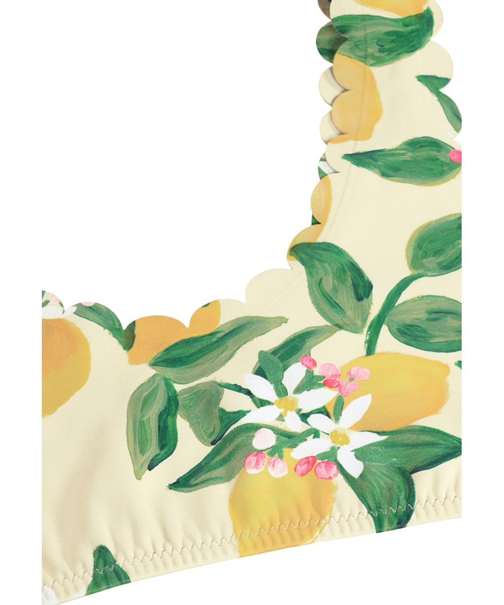 Nolina - Citrus - Gul bikini med bølgede kanter og citrusprint til aktive børn i genanvendt polyester med UV-beskyttelse 50+. 