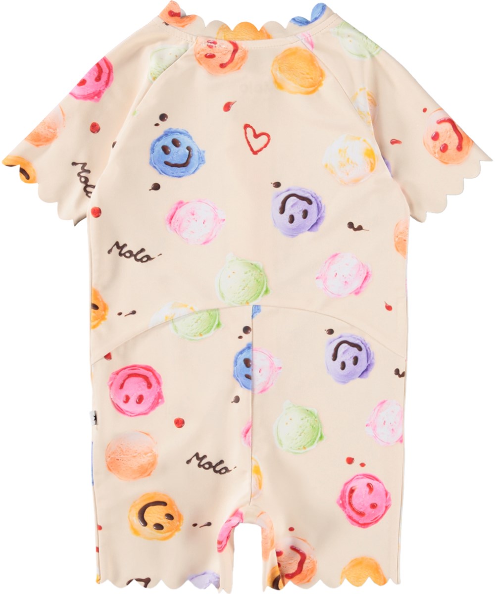 Nolu - Smile Scoops - Cremefarvet badedragt med isprint til baby og børn med korte ærmer og ben i genanvendt polyester og UV-beskyttelse 50+.