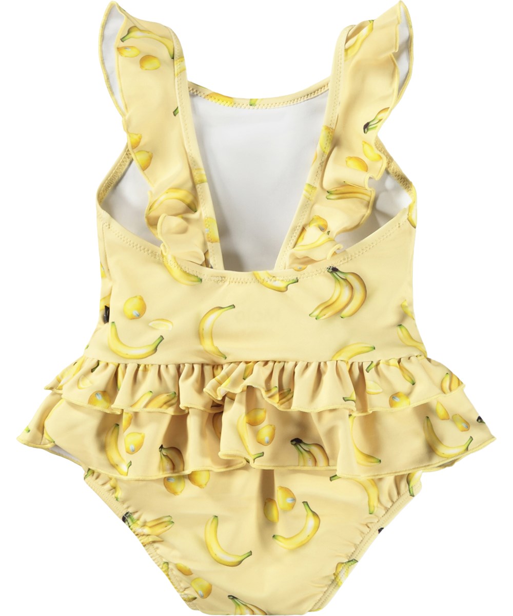 Nalani - Lemon Banana - Gul baddräkt för baby med fruktmönster i återvunnen polyester med UV-skydd 50+.