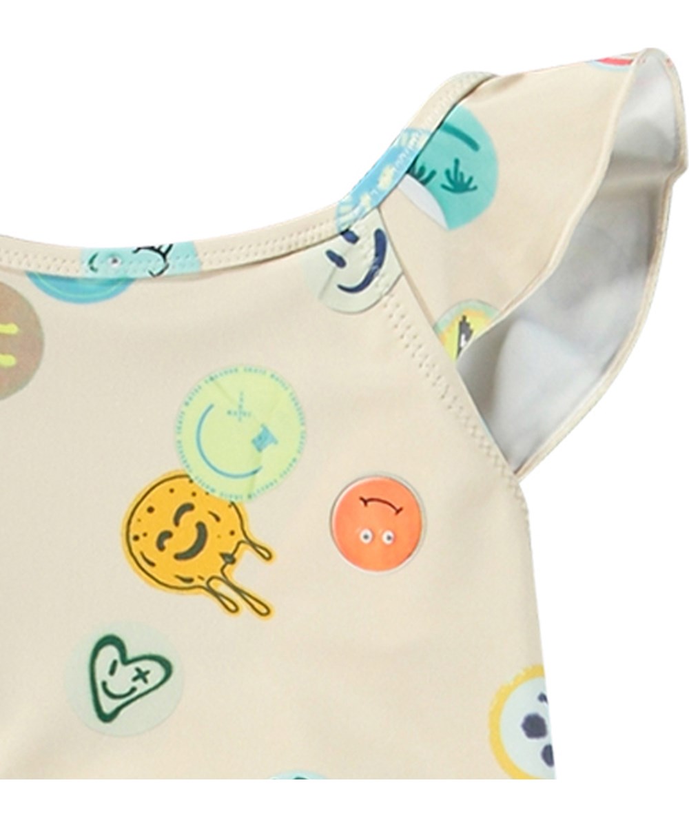 Nalani - Sand Smile - Babysimdräkt i återvunnen polyester med UV-skydd 50+.