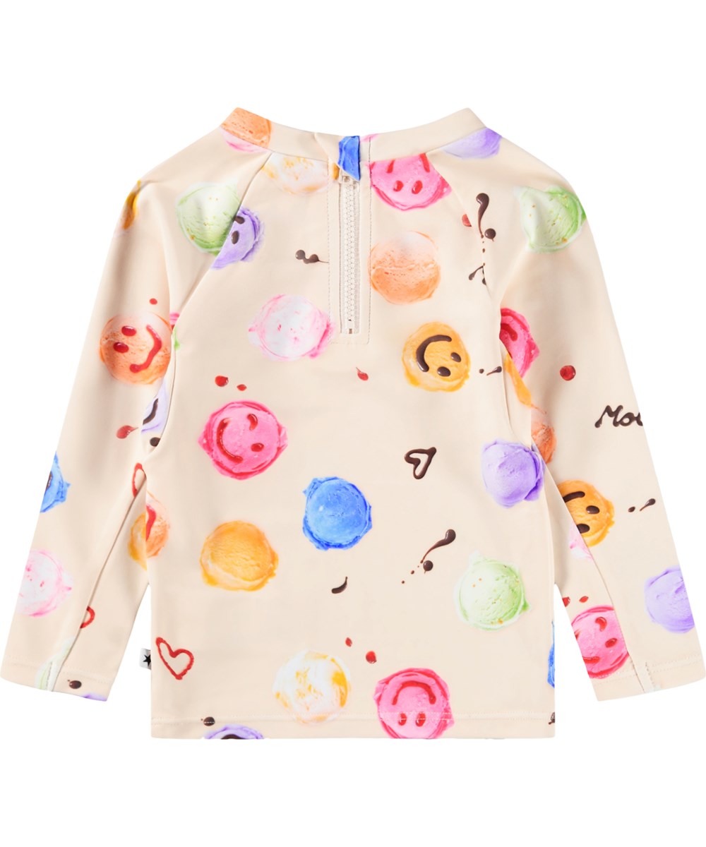 Nemo - Smile Scoops - Gräddfärgad babysimtröja med glassmönster i återvunnen polyester med UV-skydd 50+.