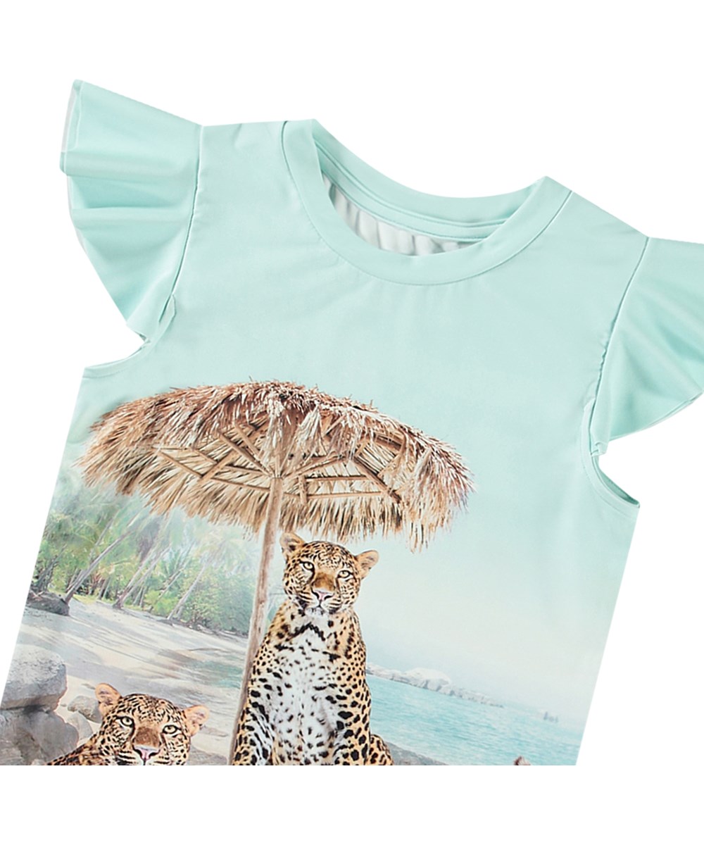 Neona - On The Beach - Ljusblå badtröja för aktiva barn tillverkad av återvunnen polyester med UV-skydd 50+.