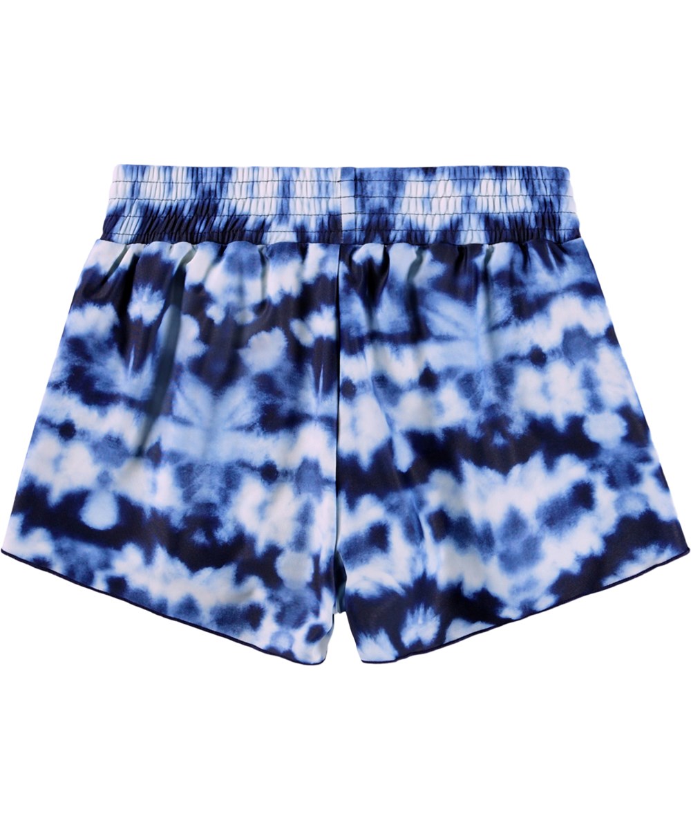 Nicci - Water - Blå batikfärgade badshorts för barn i återvunnen polyester med UV-skydd 50+.