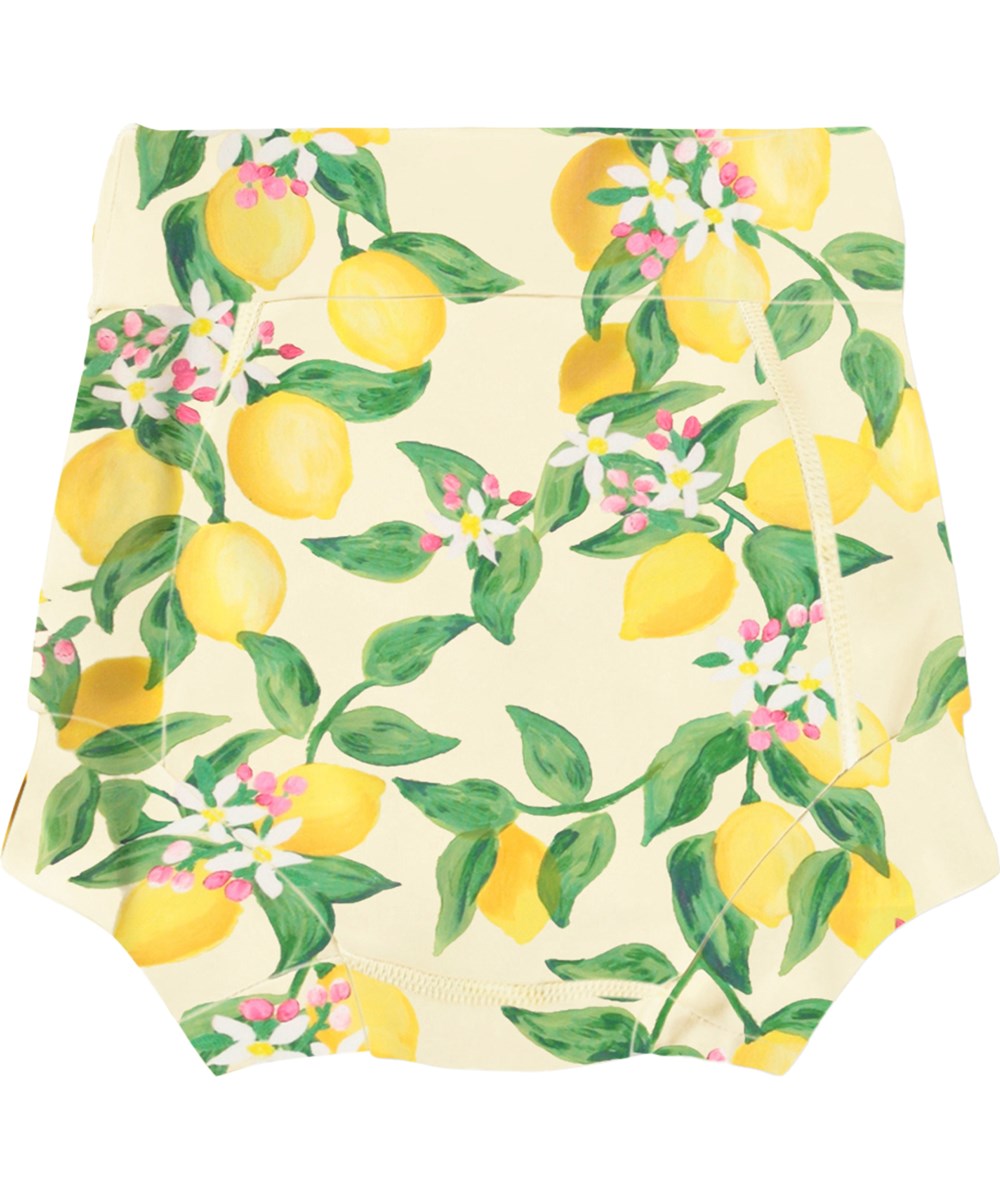 Nick - Citrus - Läckagesäkra, gula babysimbyxor med citrusmönster i återvunnen polyester med UV-skydd 50+.