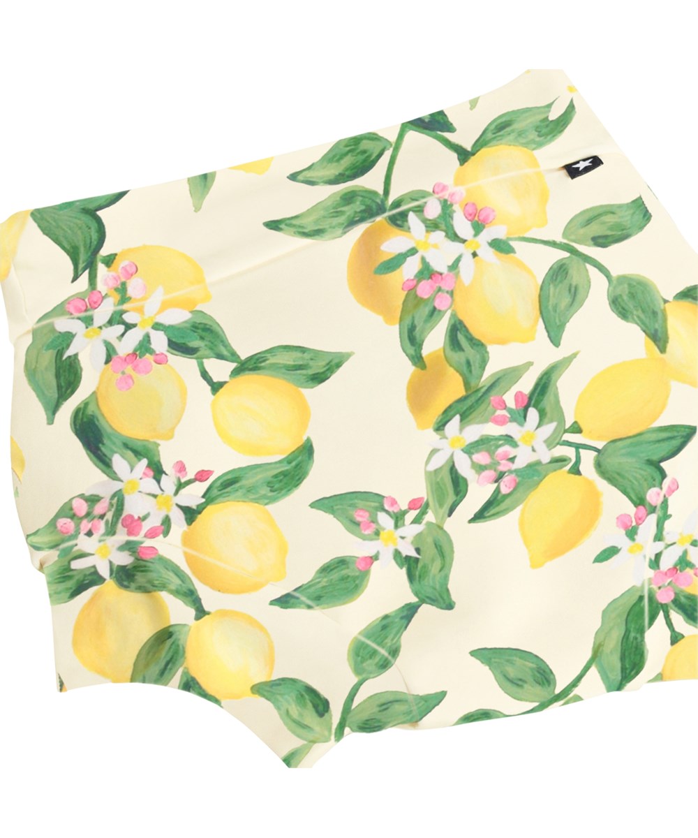 Nick - Citrus - Läckagesäkra, gula babysimbyxor med citrusmönster i återvunnen polyester med UV-skydd 50+.