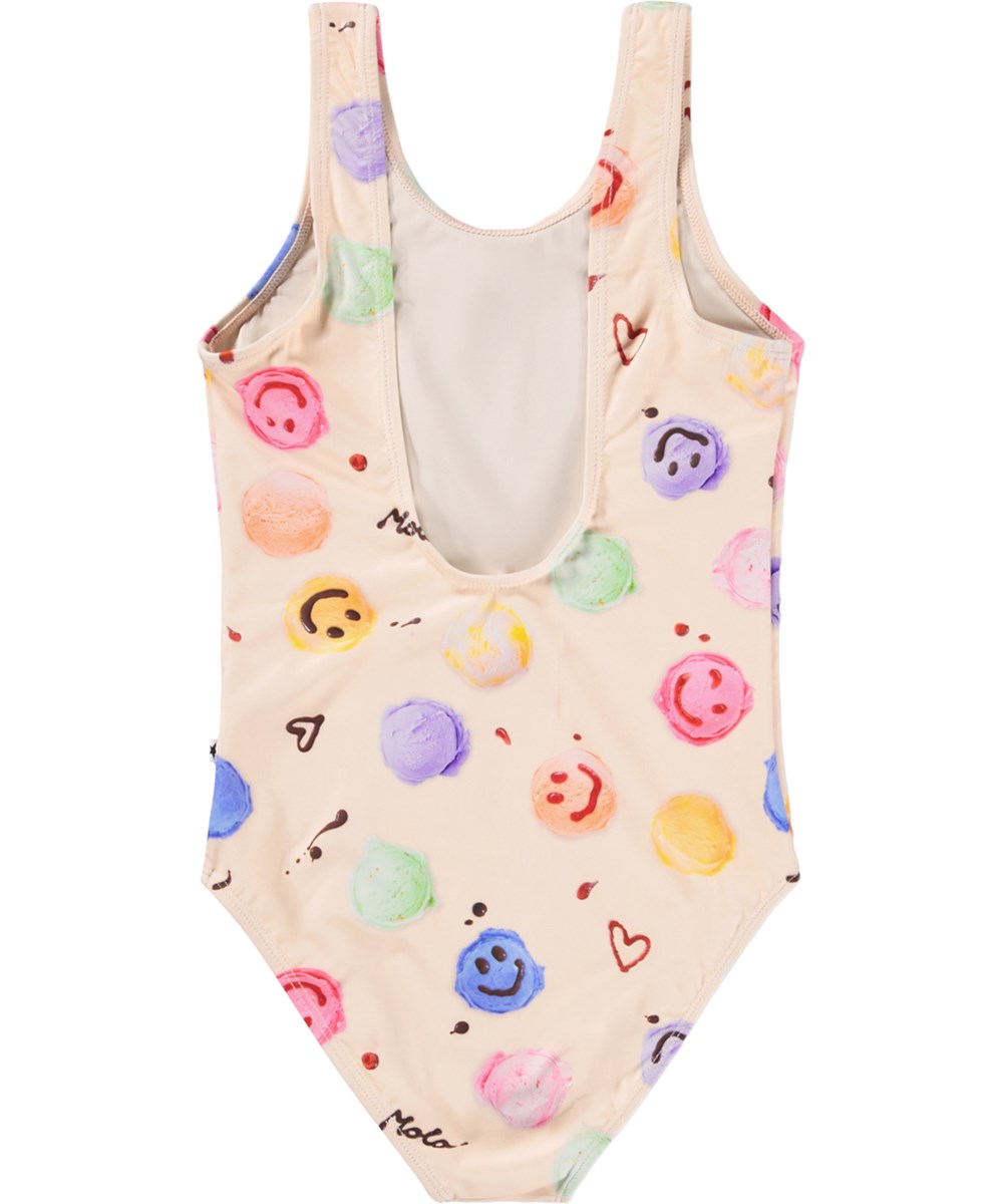 Nika - Smile Scoops - Gräddfärgad baddräkt med glassmönster för barn i återvunnen polyester med UV-skydd 50+.