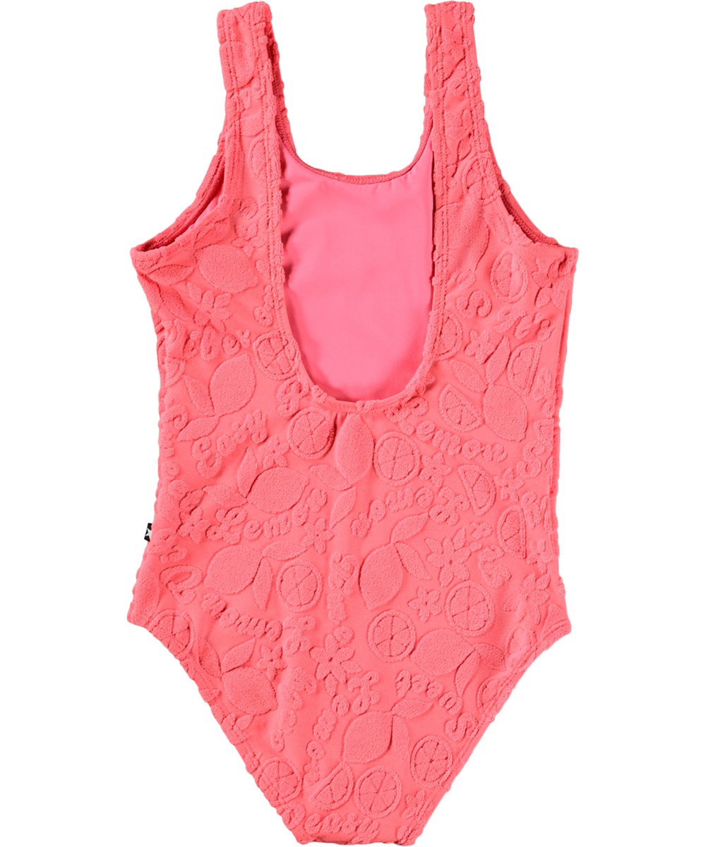 Nika Terry - Lemon Quotes - Rosa baddräkt med citrusmönster för barn i återvunnen polyester med UV-skydd 50+.
