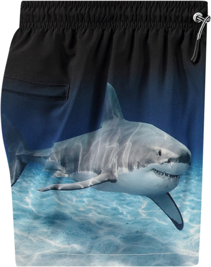 Niko - Faded Shark - Sportiga svarta och blå badshorts för aktiva barn i återvunnen polyester med UV-skydd 50+.