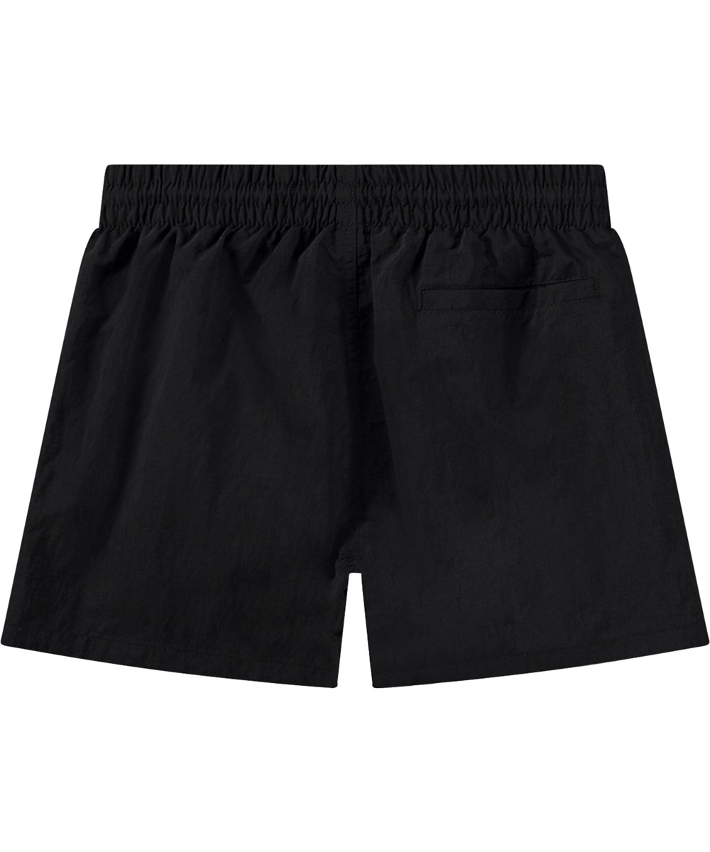 Niko Solid - Black - Sportiga svarta badshorts för aktiva barn i återvunnen nylon med UV-skydd 50+.