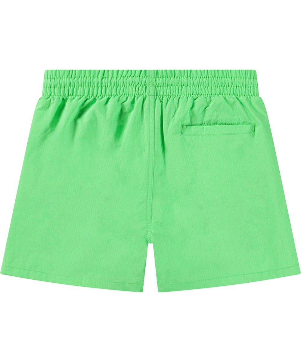 Niko Solid - Green Vibes - Sportiga gröna badshorts för aktiva barn i återvunnen nylon med UV-skydd 50+.