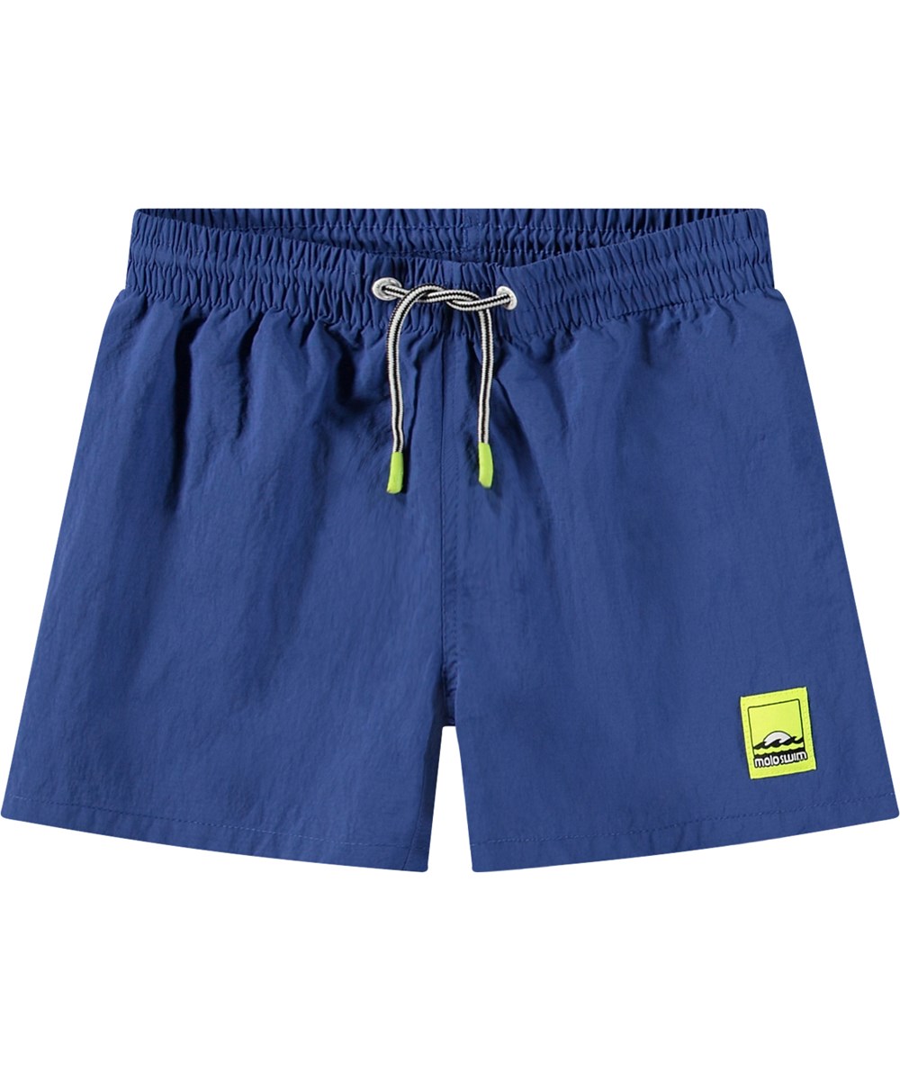 Niko Solid - Mazarine Blue - Sportiga blå badshorts för aktiva barn i återvunnen nylon med UV-skydd 50+.