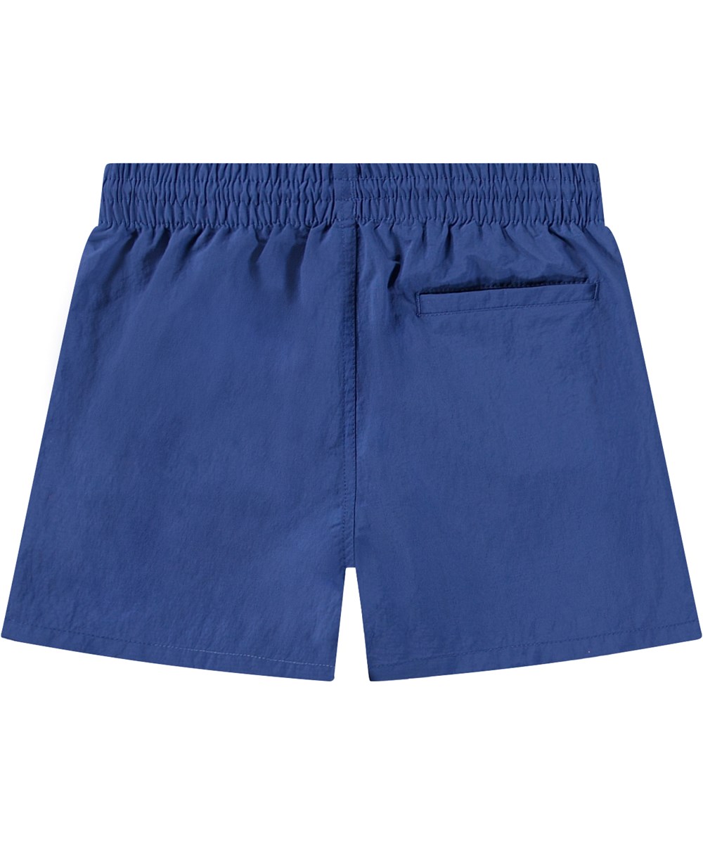 Niko Solid - Mazarine Blue - Sportiga blå badshorts för aktiva barn i återvunnen nylon med UV-skydd 50+.