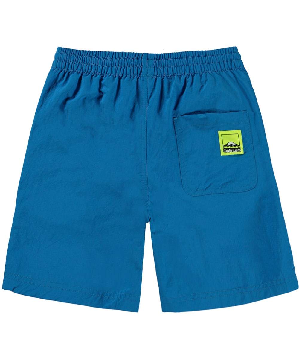 Nilson Solid - Retro Blue - Blå badshorts med långa ben.