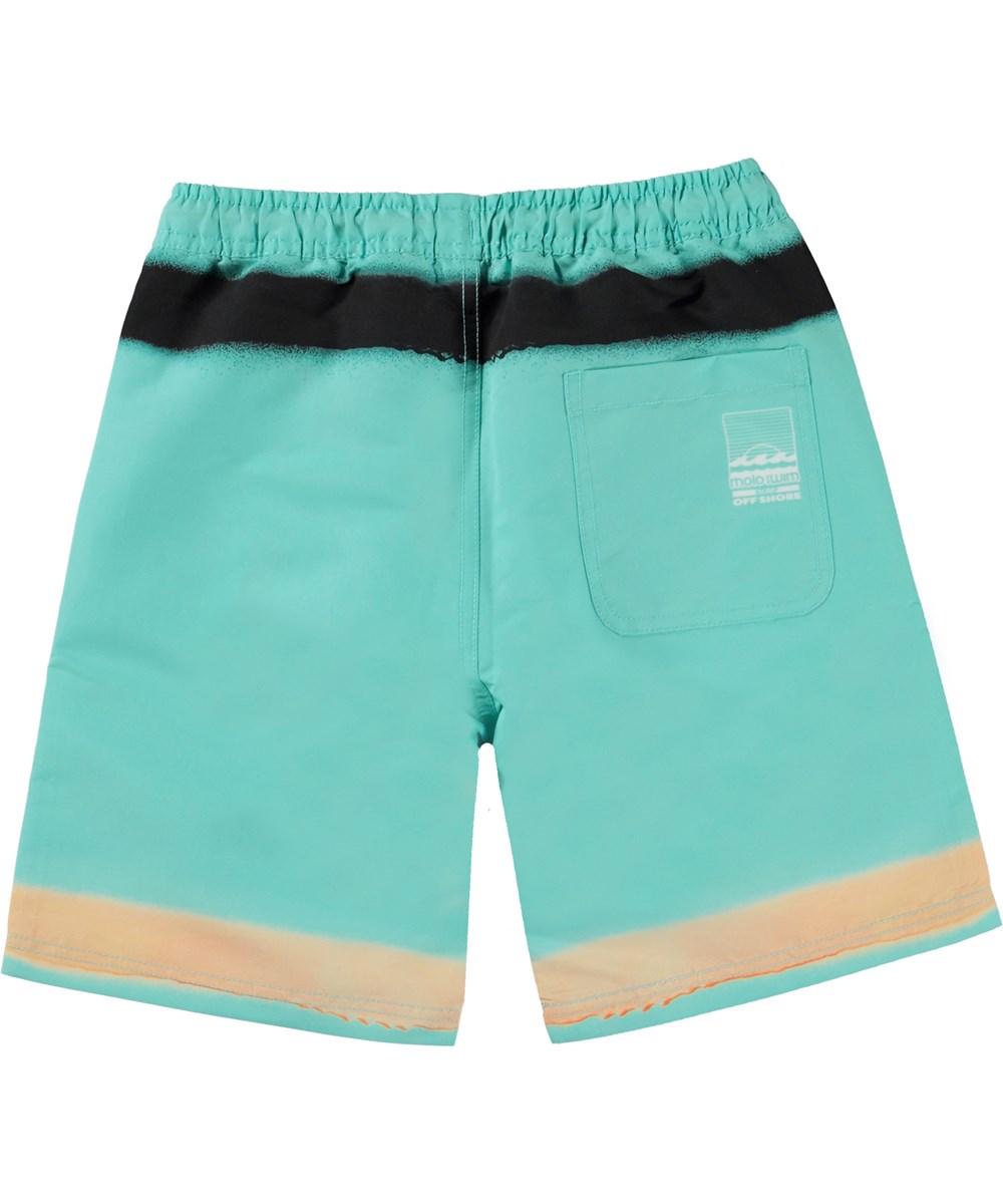 Nilson - Spray On Aqua - Turkosa badshorts med långa ben och spraymönster.