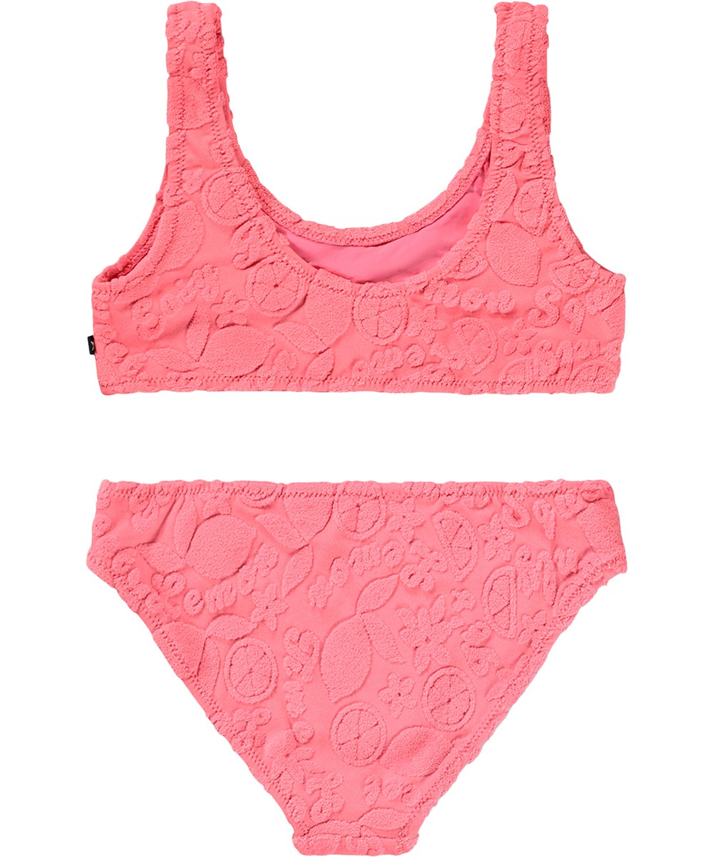 Nola Terry - Lemon Quotes - Rosa, stretchig bikini för barn med citrusmönster i återvunnen polyester med UV-skydd 50+.