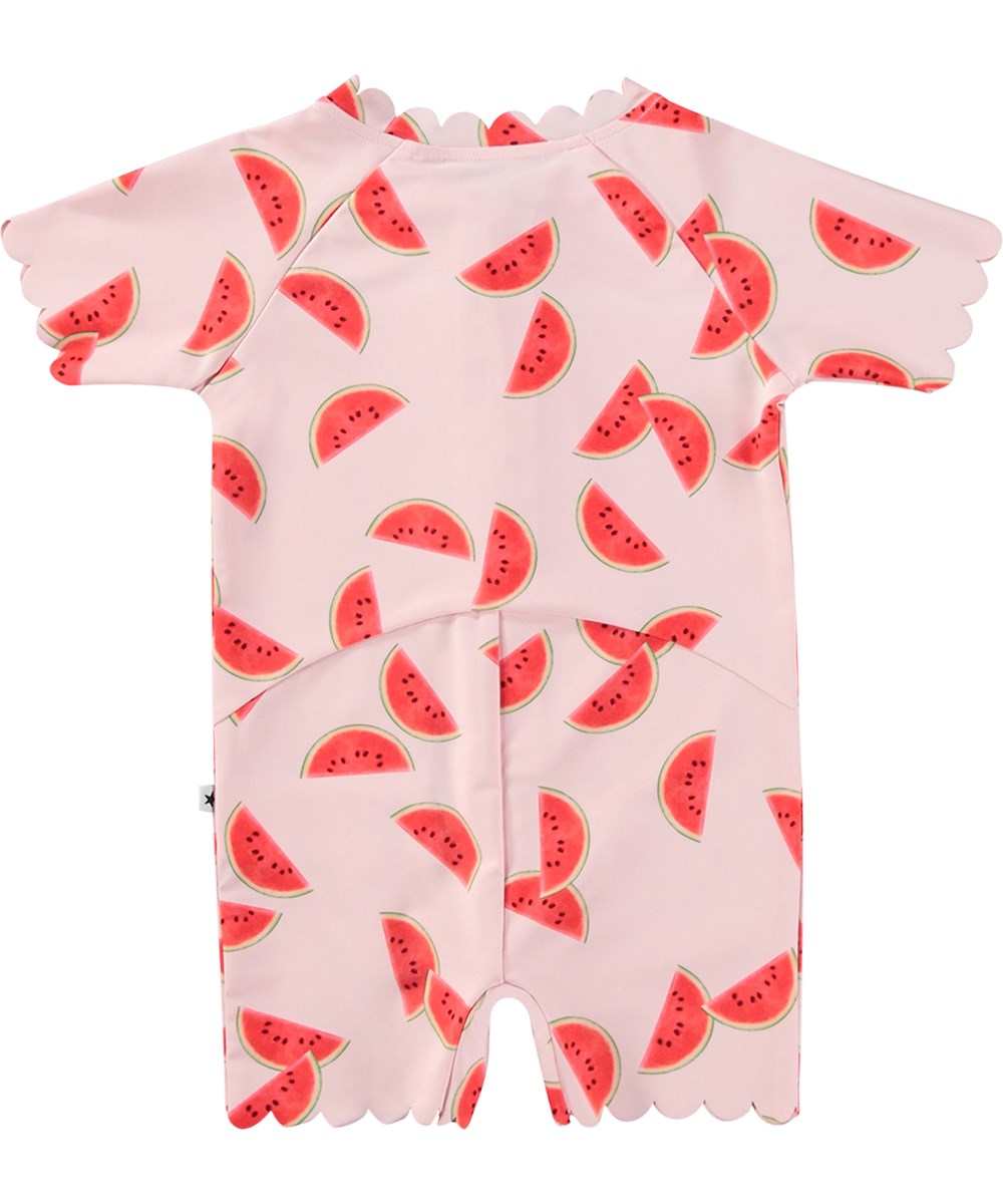 Nolu - Melon Pink - Rosa baddräkt för barn med korta ärmar och ben i återvunnen polyester och UV-skydd 50+.