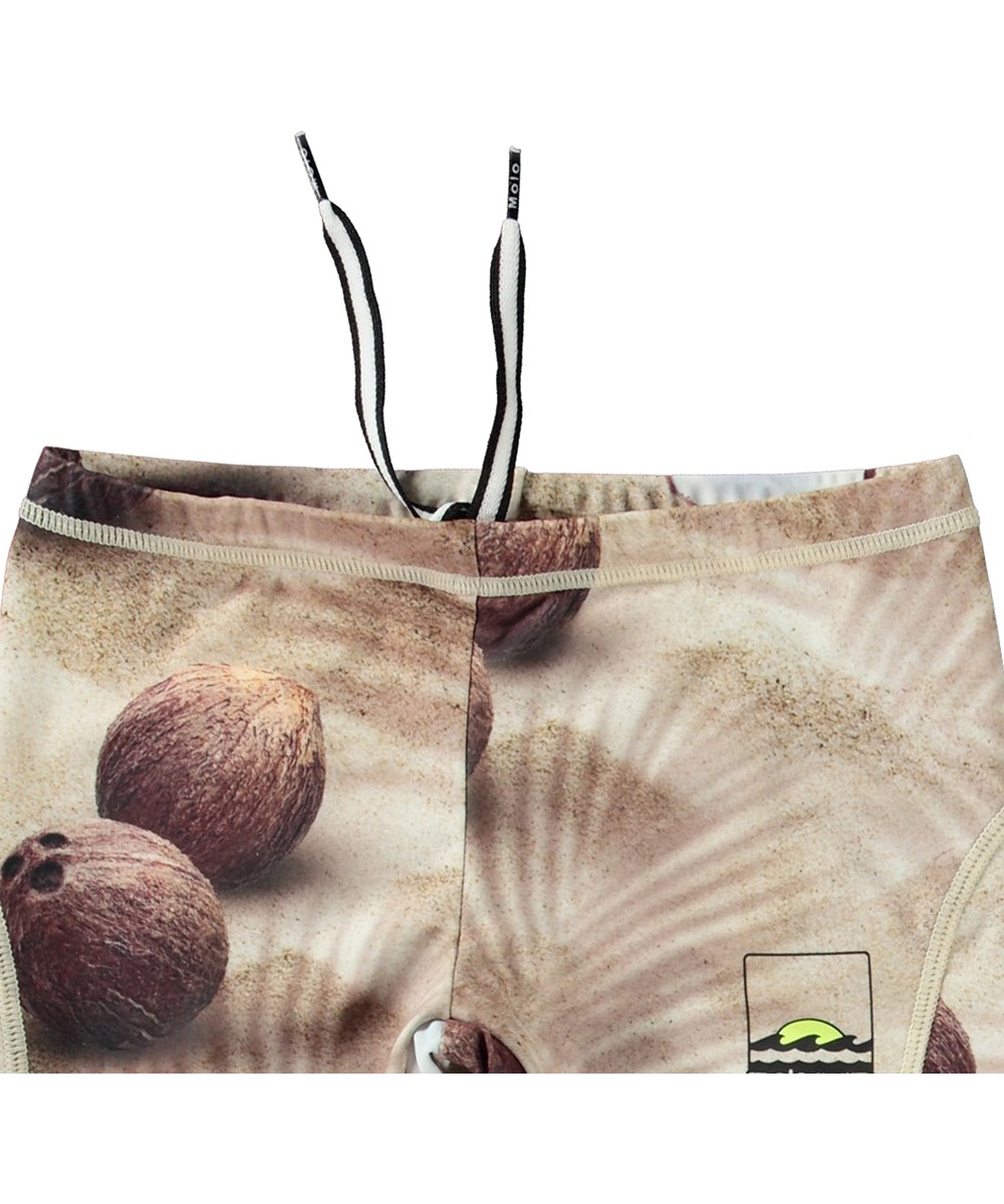 Norton - Coconuts - Beiga sportiga badshorts för aktiva barn i återvunnen polyester med UV-skydd 50+.