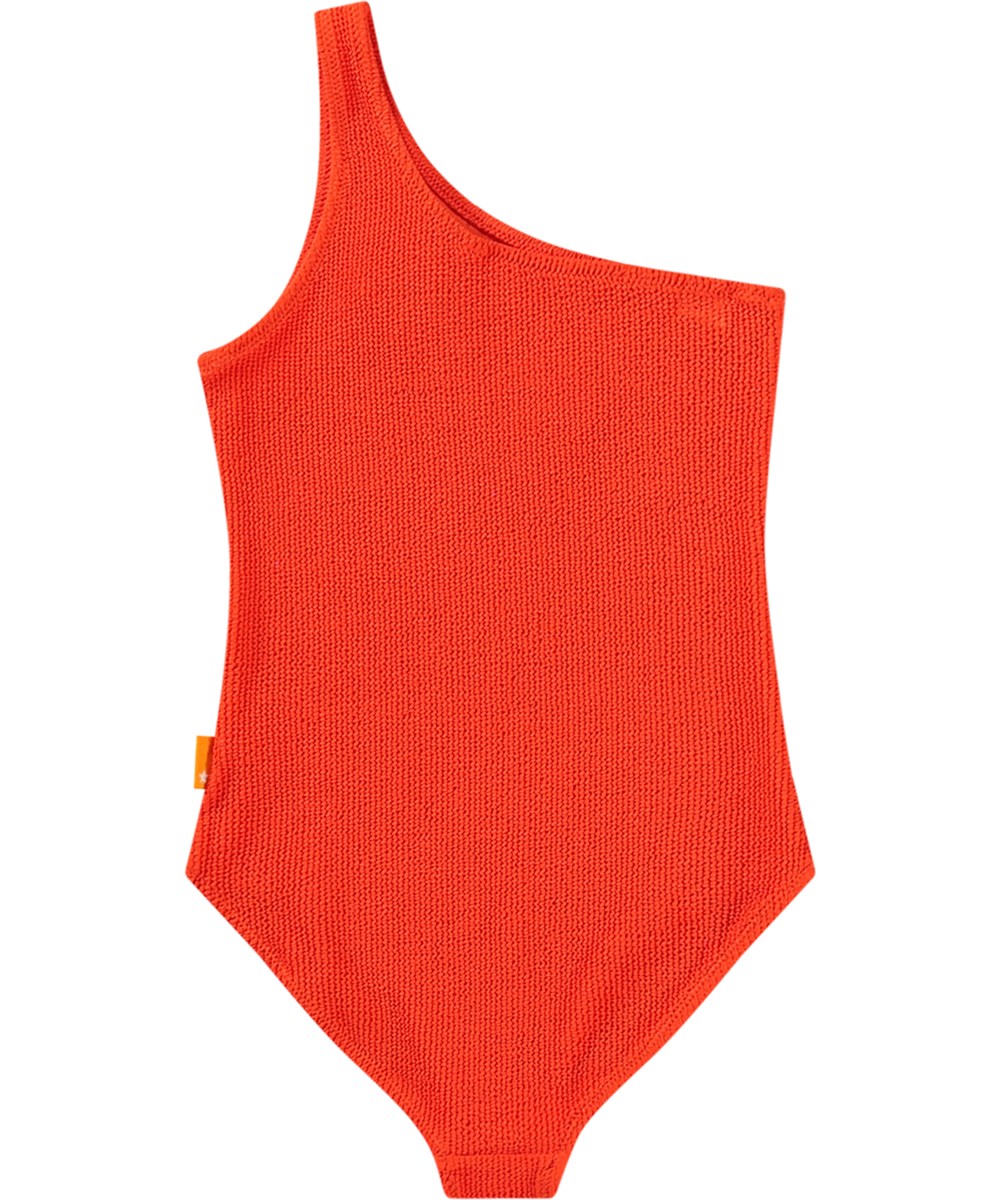 Nai Solid - Strawberry Hot - Rode assymetrische badpak met ribbels en UV-bescherming 50+ voor kinderen.