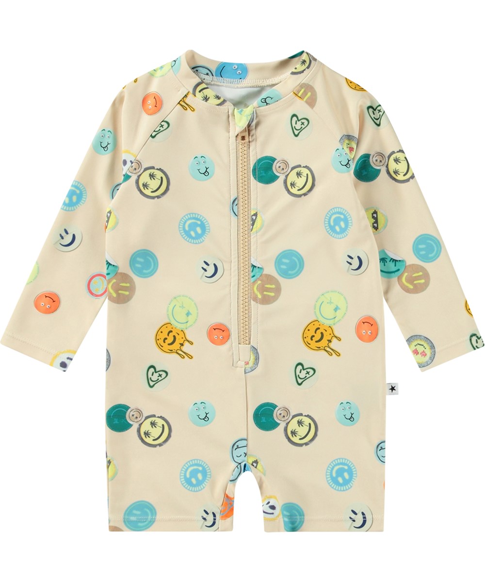 Neka LS - Sand Smile - Beige badpak met lange mouwen en korte pijpen van gerecycled polyester en UV-bescherming 50+ gemaakt voor kinderen.