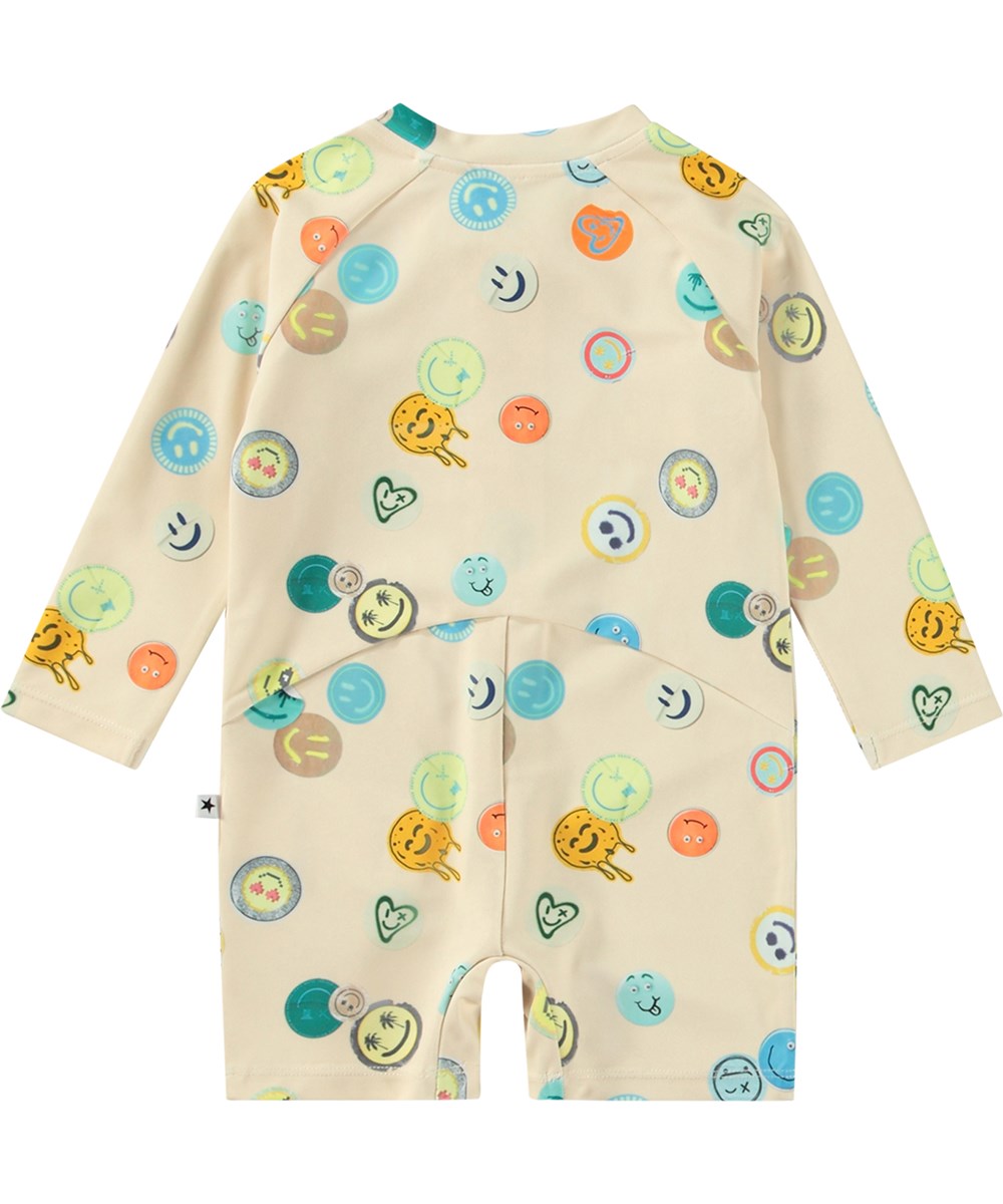 Neka LS - Sand Smile - Beige badpak met lange mouwen en korte pijpen van gerecycled polyester en UV-bescherming 50+ gemaakt voor kinderen.