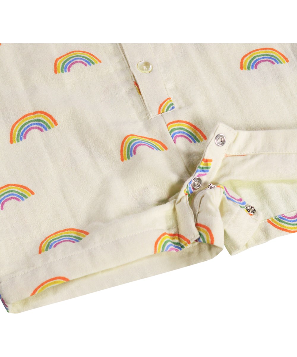 Falkone - Small Rainbows - Krämfärgad romper för de små i ekologisk bomull med regnbågsmönster