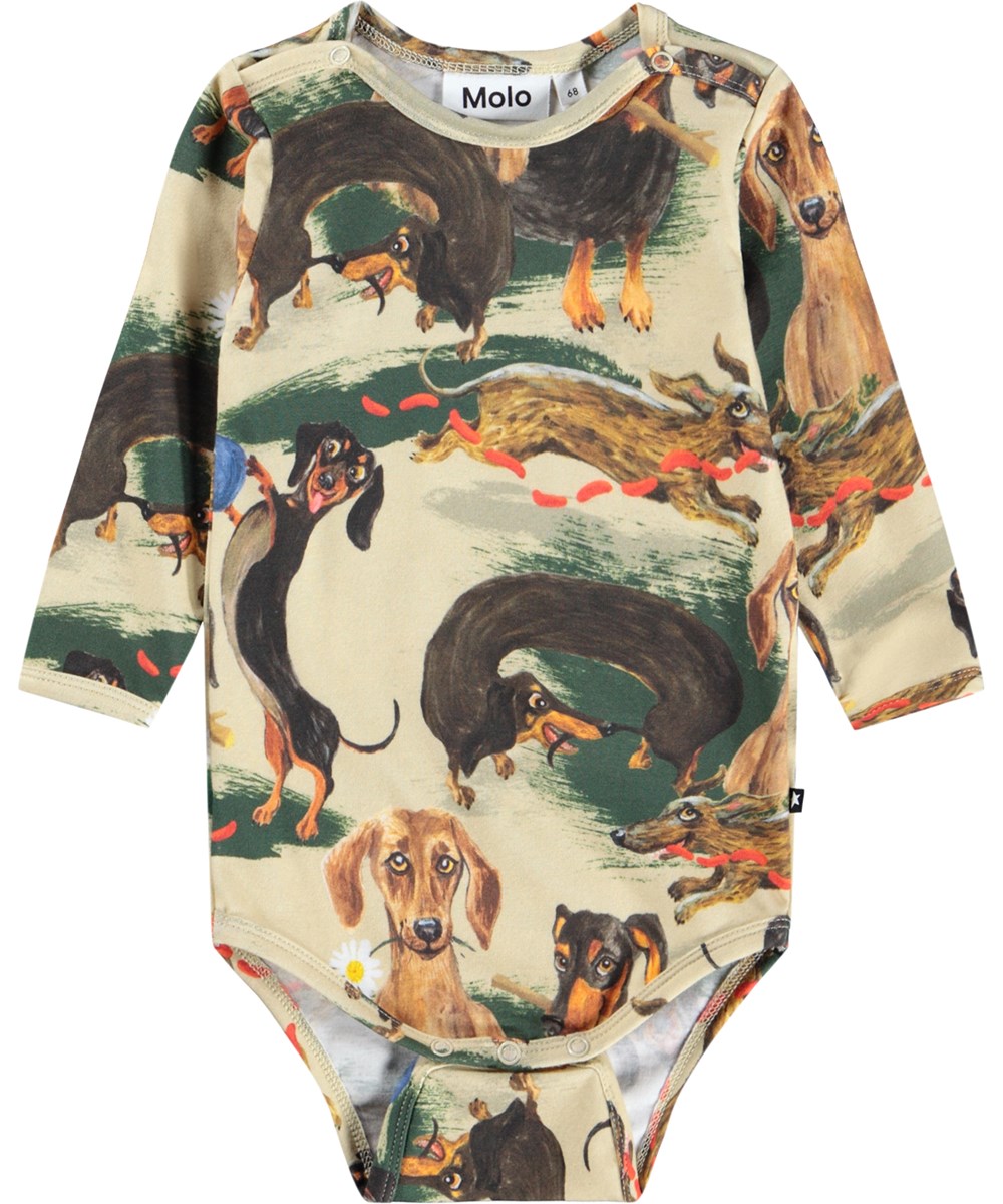 Foss - Painted Dogs - Beige långärmad body i ekologisk bomull för baby med taxar.