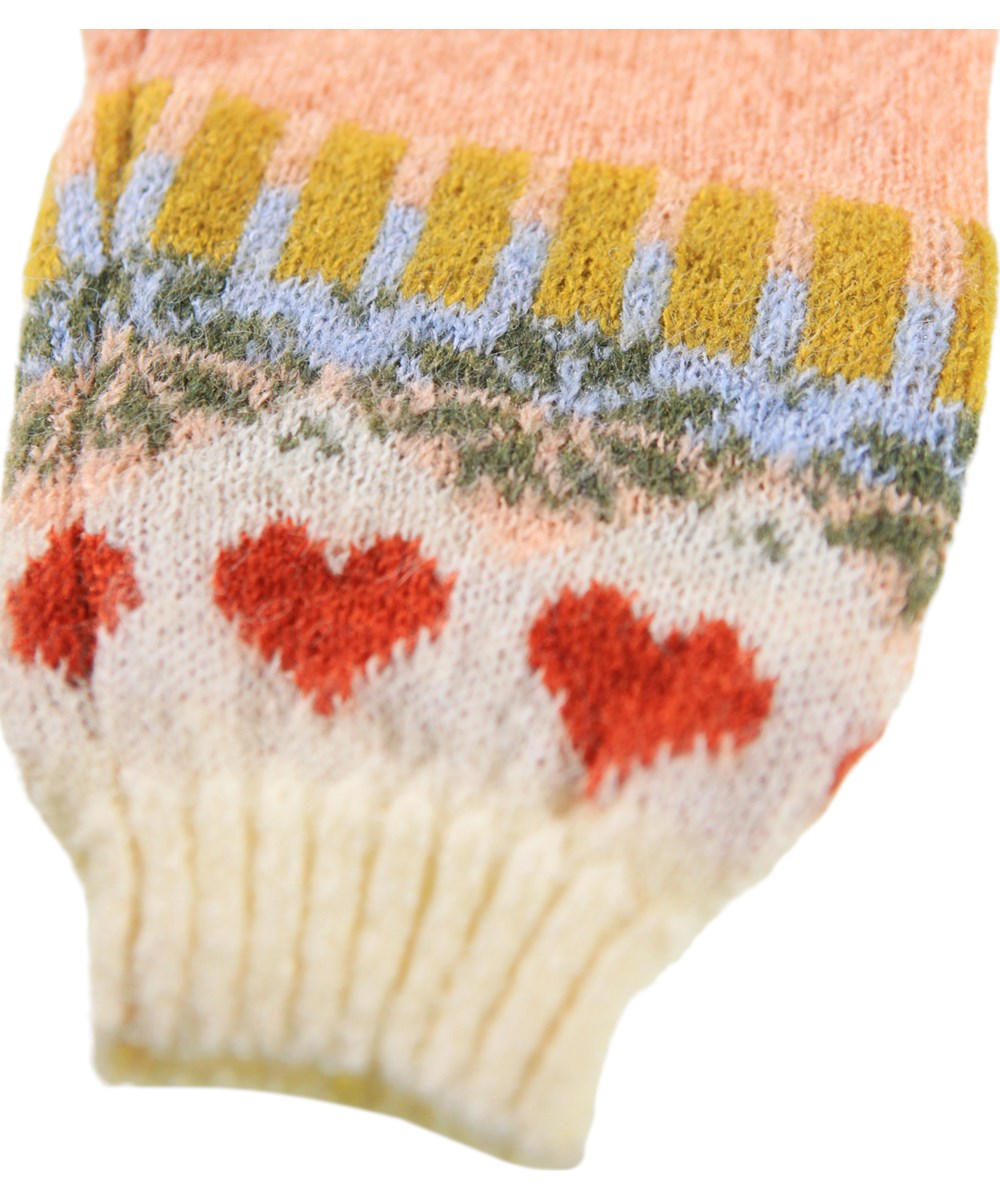 Frej - Nordic Bunny - Rosa heldräkt för de minsta i en mjuk alpackaull med nordiskt inspirerat mönster.