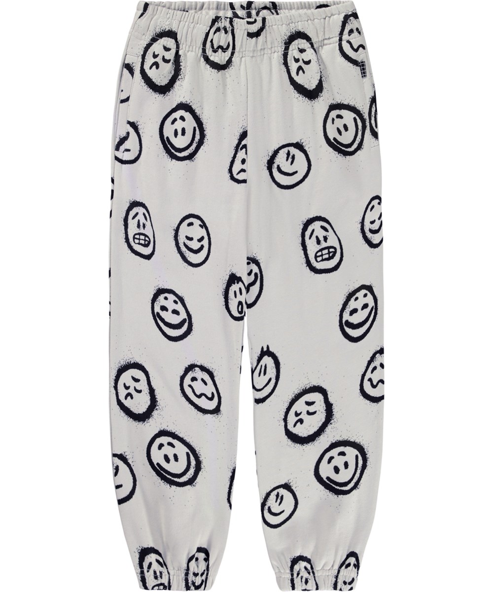 Adan - Different Moods - Off-whitea sweatpants för barn tillverkade av ekologisk bomull med smileys.