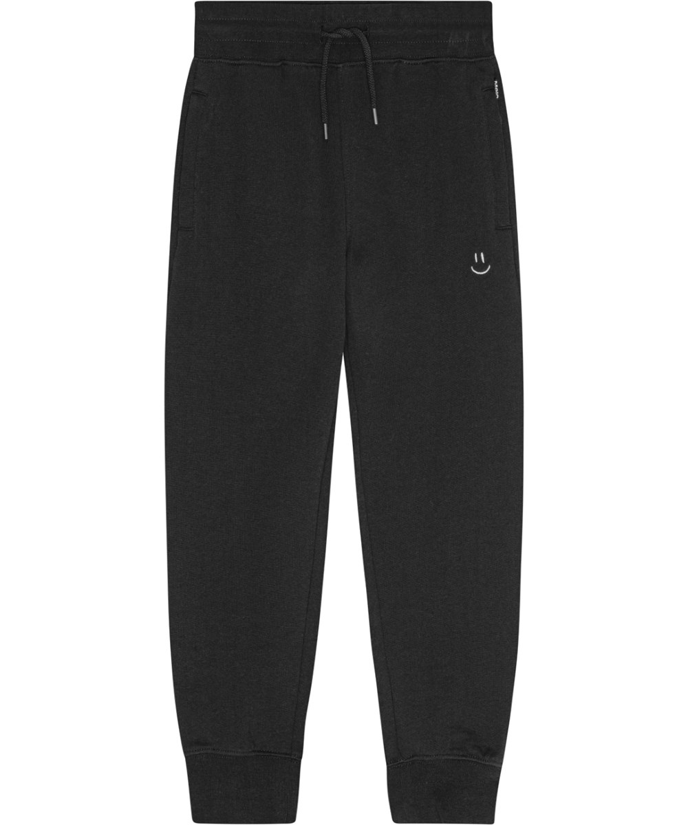 Alvar - Black - Svarta ekologiska bomullsbyxor med gummiband i midjan, fickor med dragkedja, normal passform och broderad smiley.