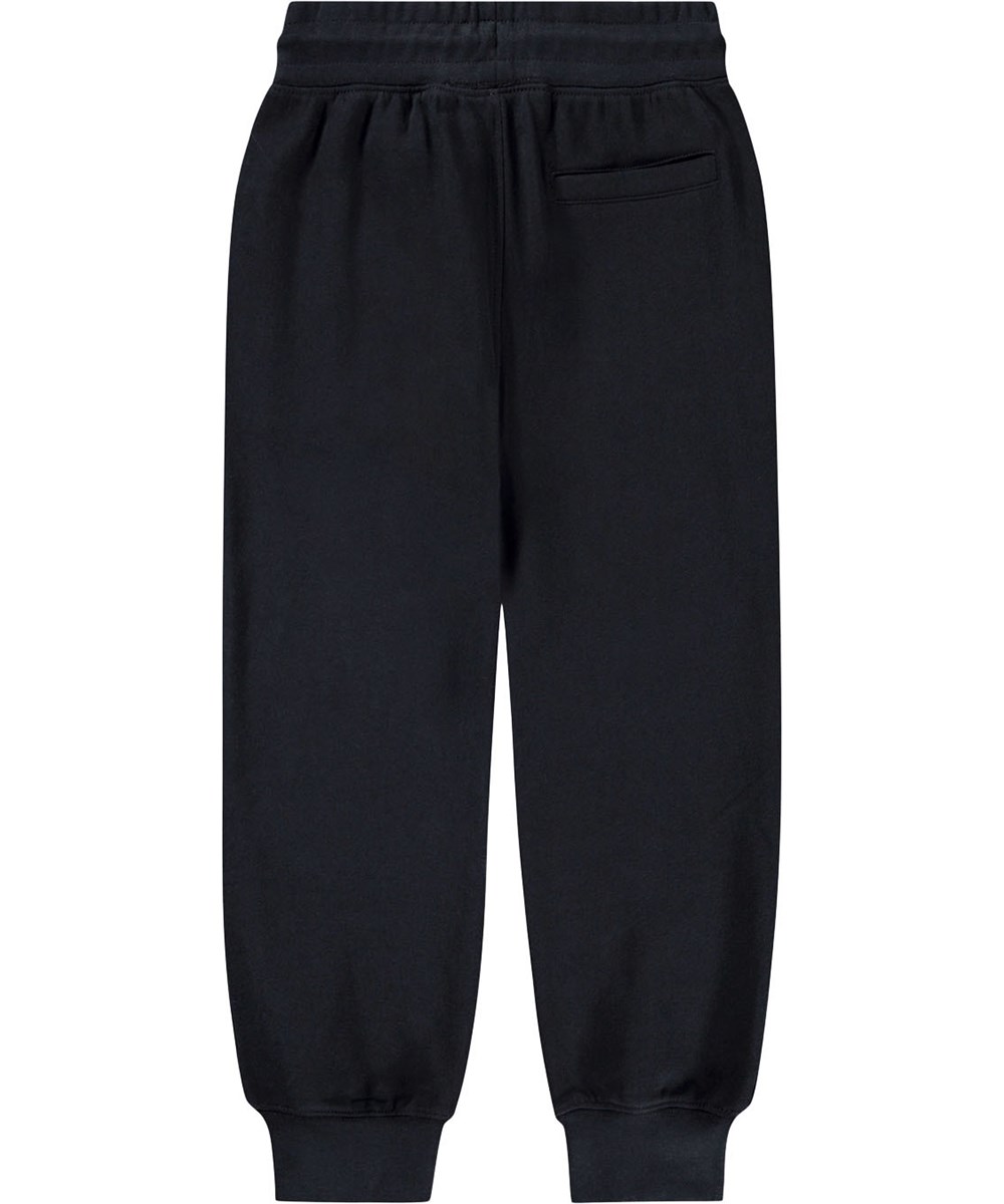 Alvar - Black - Svarta sweatpants i ekologisk bomull med broderat vitt leende ansikte.