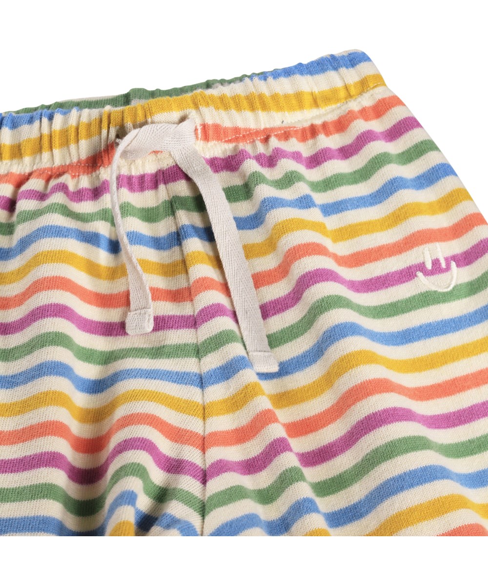 Saxon - Mini Rainbow - Mjuka, flerfärgade byxor för de små i ekologisk bomull med regnbågsränder