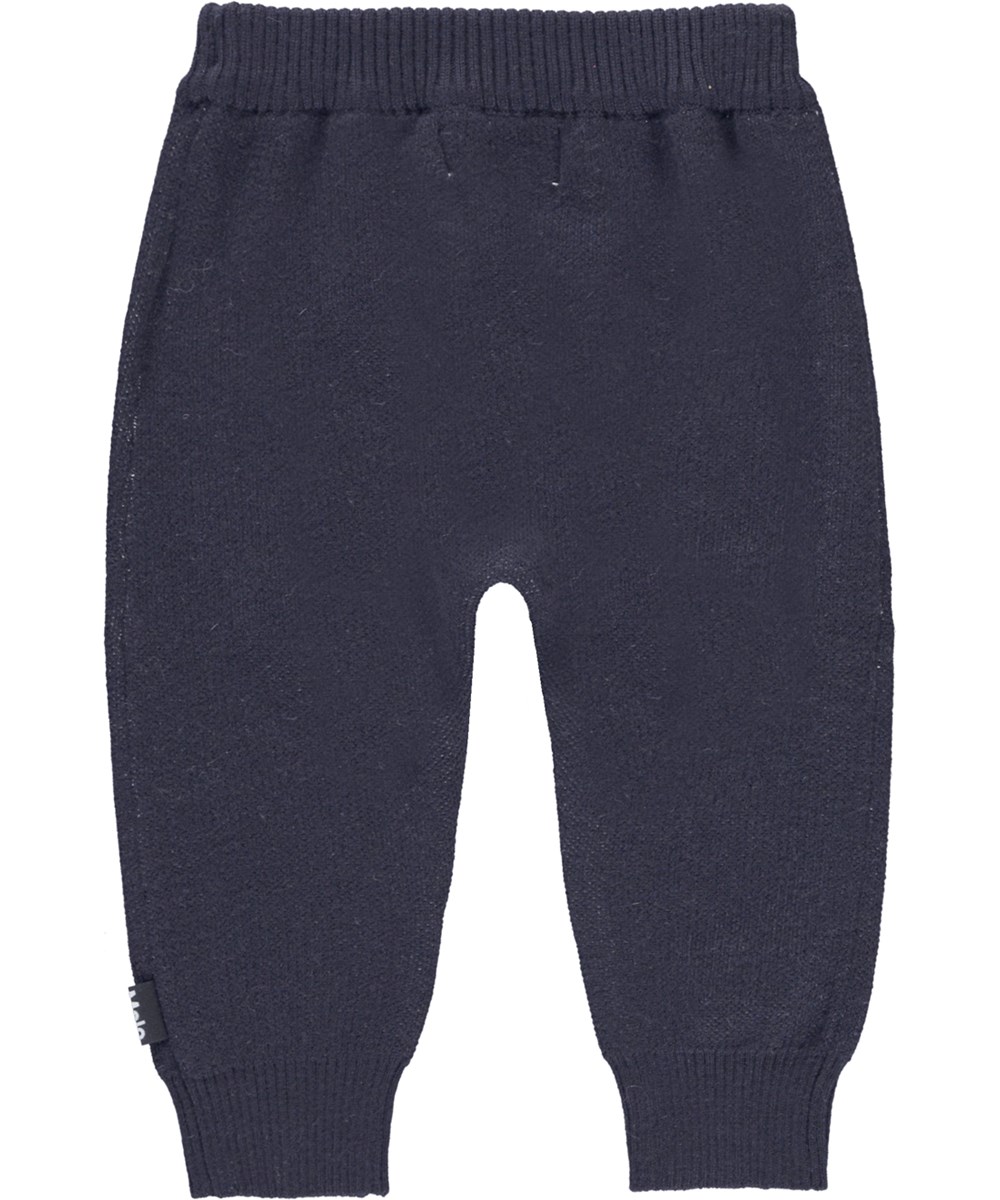 Sol - Galaxy Blue - Mörkblå stickade babybyxor med smileys.