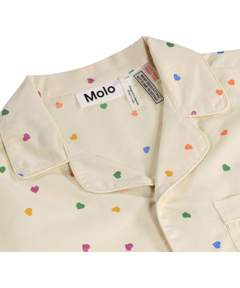 Lexi - Confetti_Rainbow - Beige pyjamaset för barn i ekologisk bomull med mönster