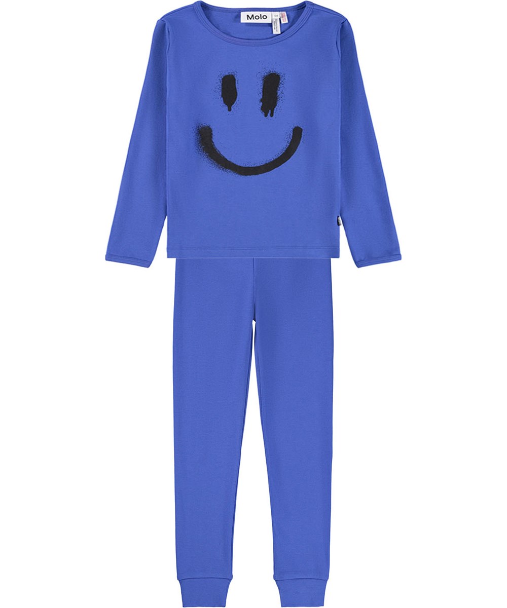 Lue - Dazzling Blue - Blå pyjamas set för barn gjord av ekologisk bomull med spraymålat leende i svart.