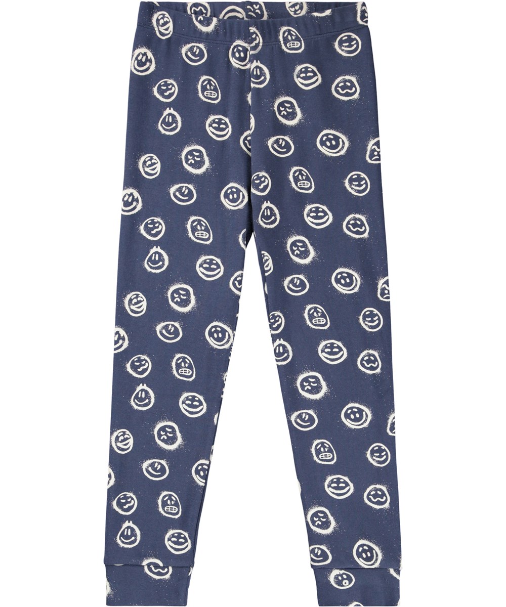 Lue - Galaxy Moods - Mörkblå pyjamasset för barn tillverkat av ekologisk bomull med vita ansikten spraymålade i olika stämningar.