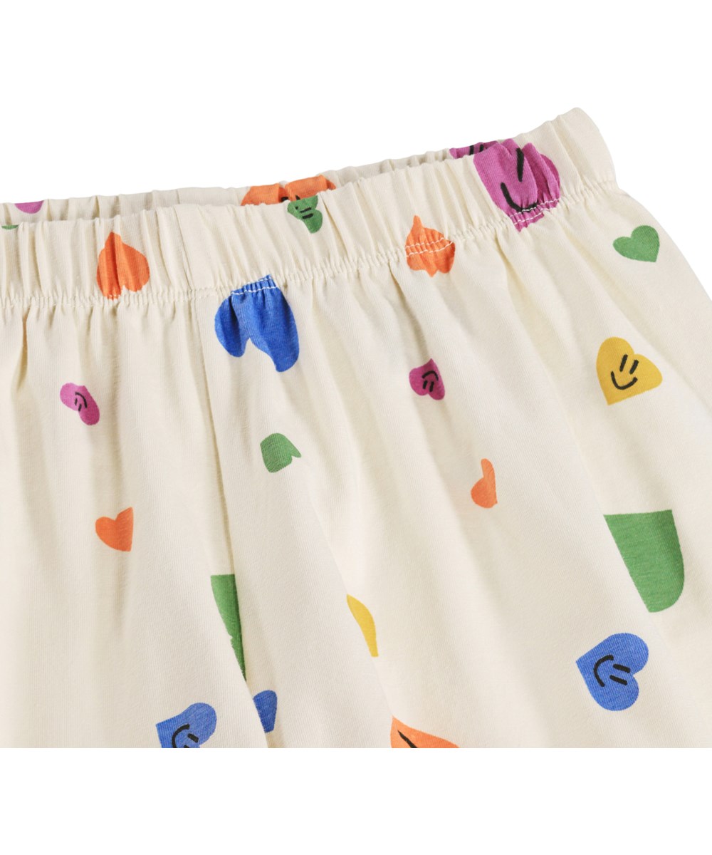 Luvis - Confetti Smiles - Beige tvådelad pyjamas för barn i ekologisk bomull med mönster